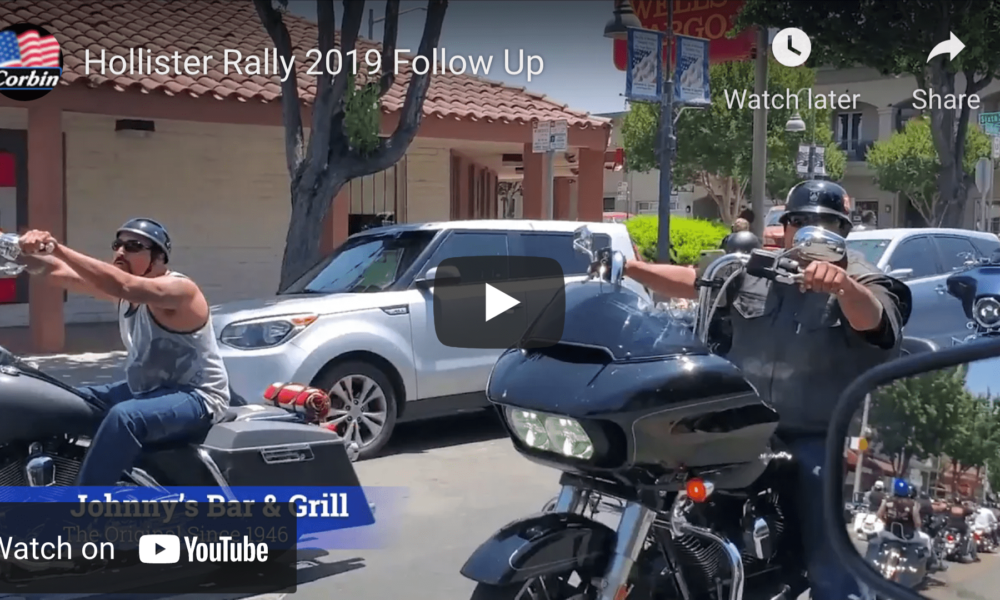 Two motorcyclists riding on San Benito Street during Hollister biker rally