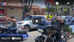 Two motorcyclists riding on San Benito Street during Hollister biker rally